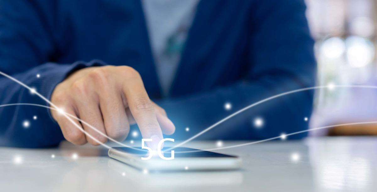 hand-on-phone-with-5g-icon